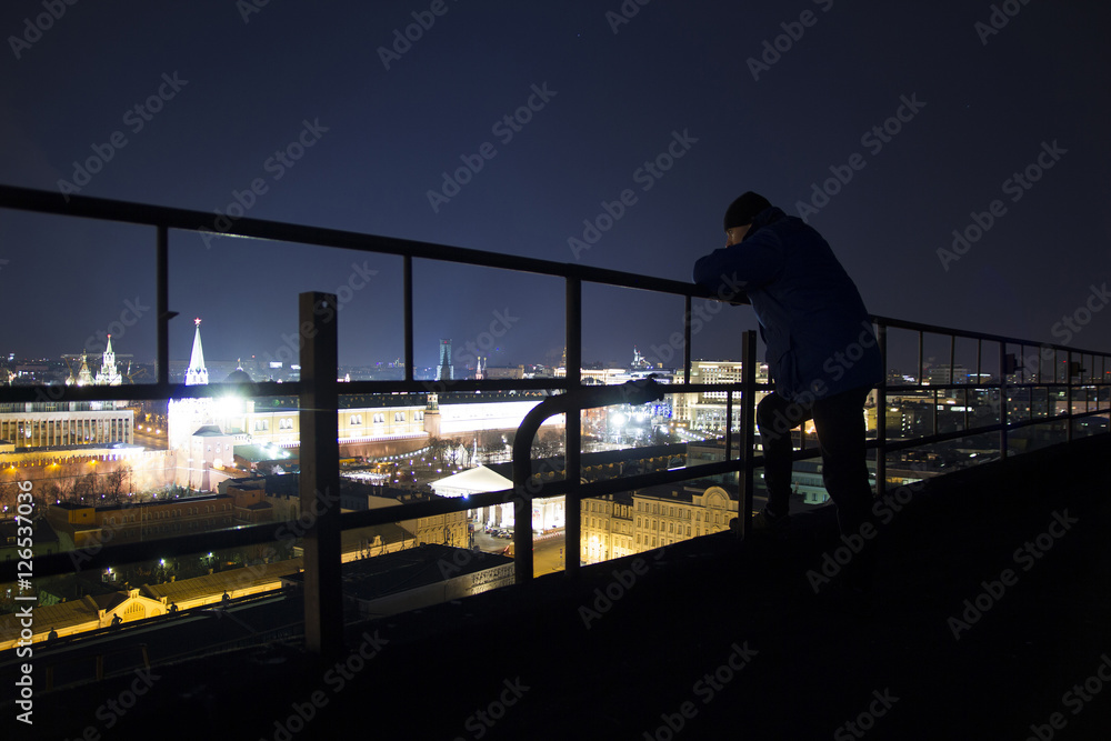 A man posing on the roof A man posing on the roof