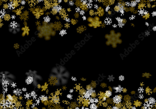 Snowfall background with golden snowflakes blurred in the dark