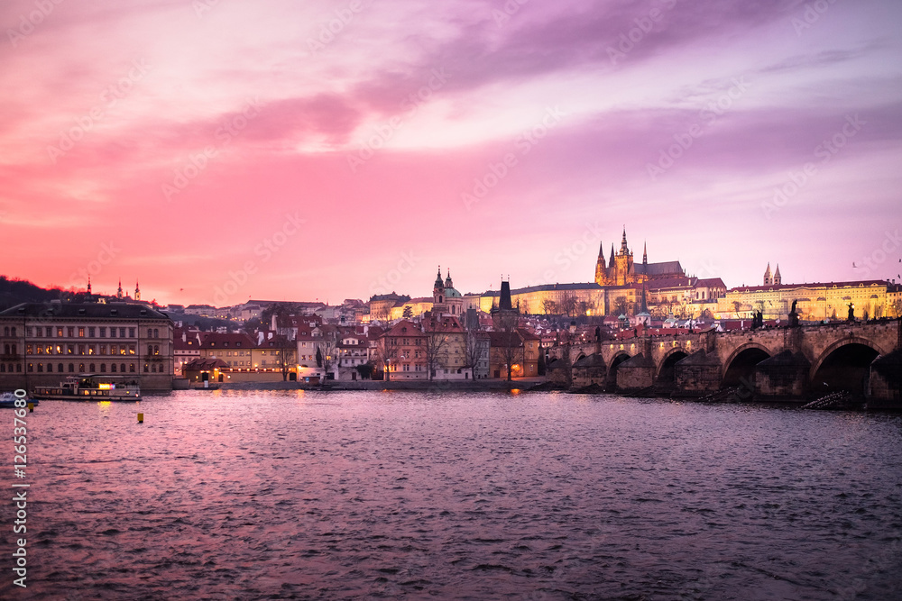 Panoramic View of Prague Castle, Charles Bridge and St Vitus Cathedral reflected in the Vltava river at dusk - Prague - Czech Republic