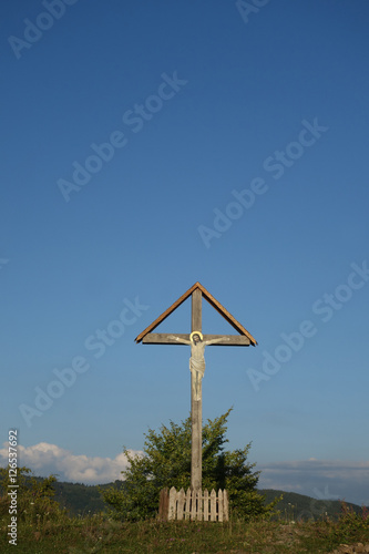 Sign of faith. Wooden cross in a cloudy sky. Mount Kobila, Transcarpathia photo