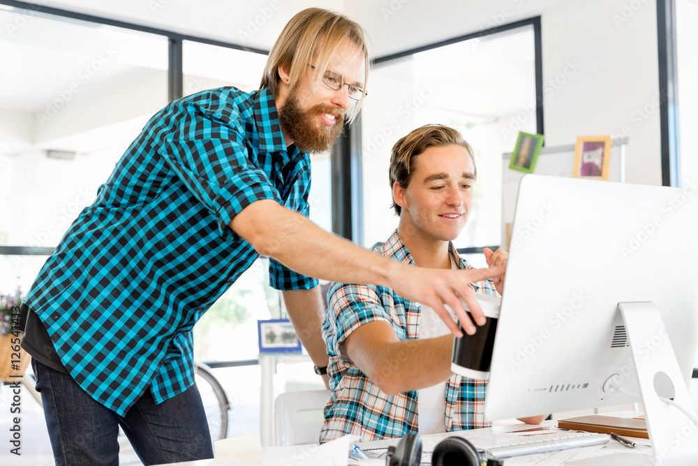 Fototapeta premium Two office workers at the desk