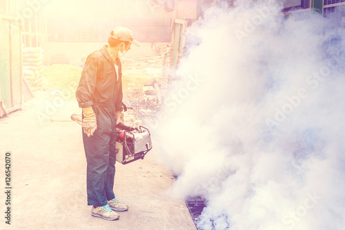 Man work fogging to eliminate mosquito for prevent spread dengue fever and zika virus