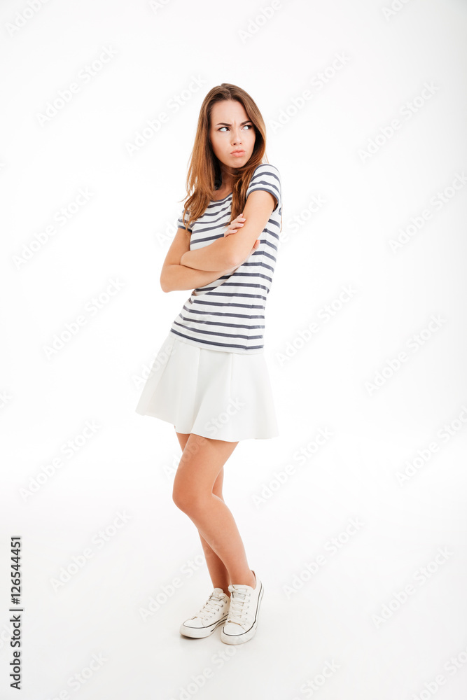 Angry upset woman standing with arms crossed Angry upset woman standing with arms crossed