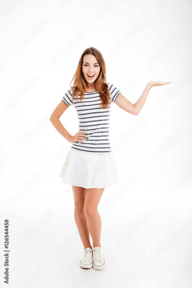 Portrait of a smiling woman holding copyspace on the palm Portrait of a smiling woman holding copyspace on the palm
