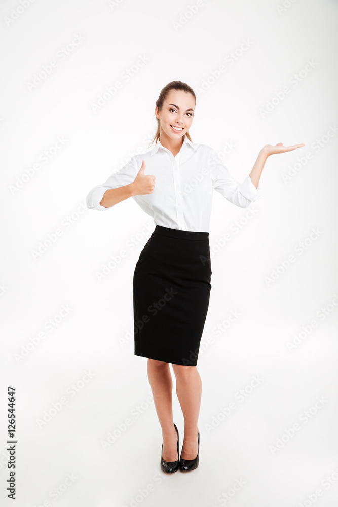 Portrait of a beautiful businesswoman holding copy space on palm Portrait of a beautiful businesswoman holding copy space on palm