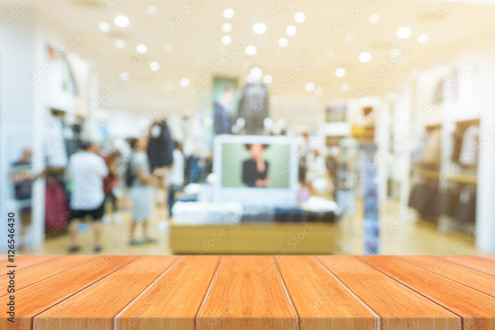 Wooden board empty table blurred background. Perspective brown wood over blur in department store - can be used for display or montage your products.Mock up for display of product. Wooden board empty table blurred background. Perspective brown wood over blur in department store - can be used for display or montage your products.Mock up for display of product.