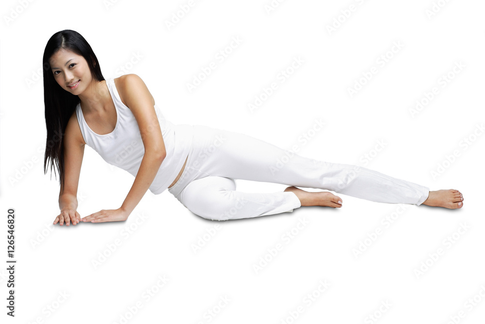 Woman lying on side, smiling at camera, portrait Woman lying on side, smiling at camera, portrait