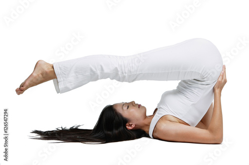 Woman doing yoga, shoulder stand position