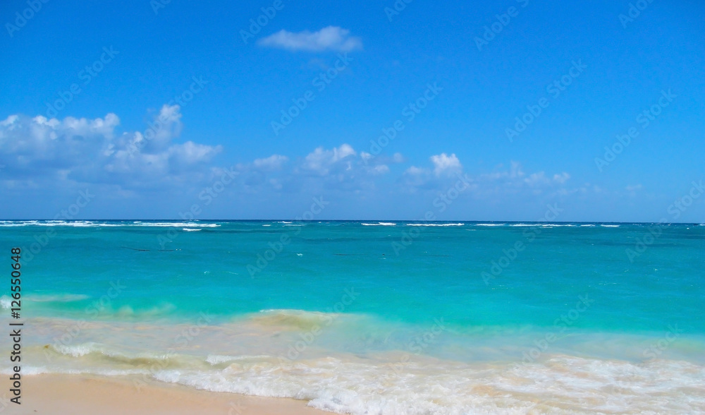 Azure turquoise ocean and the tropical sand beach background. Caribbean coast