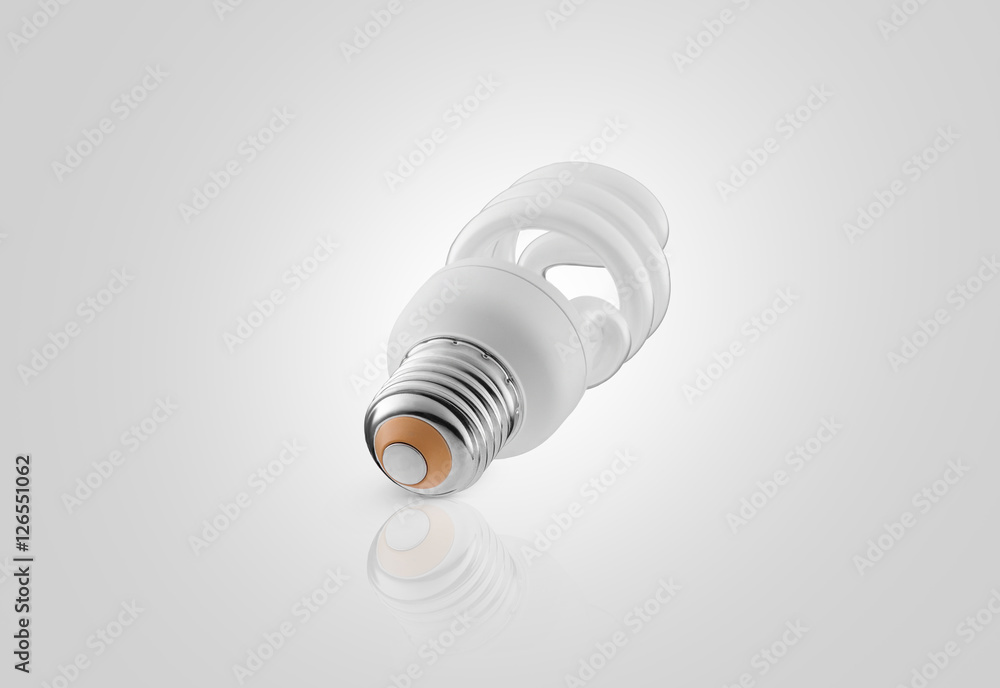 one energy saving lamp on a white background with reflection one energy saving lamp on a white background with reflection