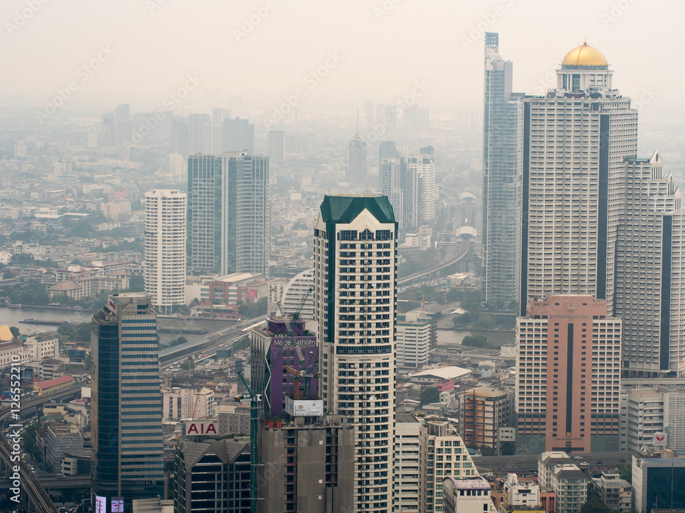 Fototapeta premium Bird's eye view cityscape of building in Bangkok city. Top view tower in Bangkok, Thailand.