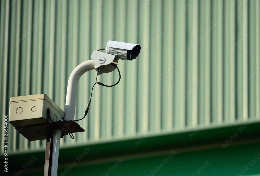 White CCTV camera watching for security 24 hours