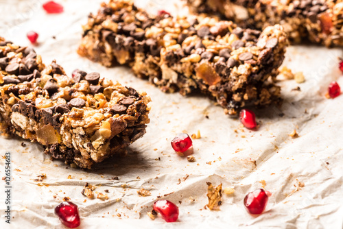 healthy homemade muesli bar with cereals, chocolate and pomegran