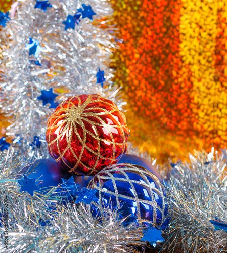 Silver sparkling tinsel and christmas balls on gold background