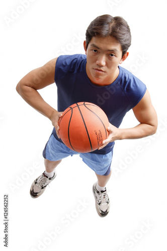 Young man holding basketball