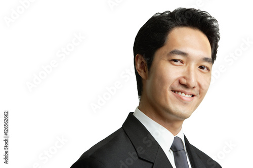 Businessman smiling at camera, head shot