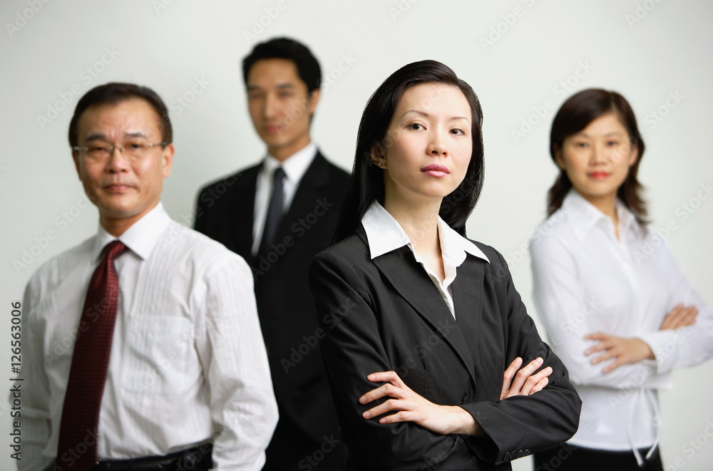 Executives with arms crossed, looking at camera Executives with arms crossed, looking at camera