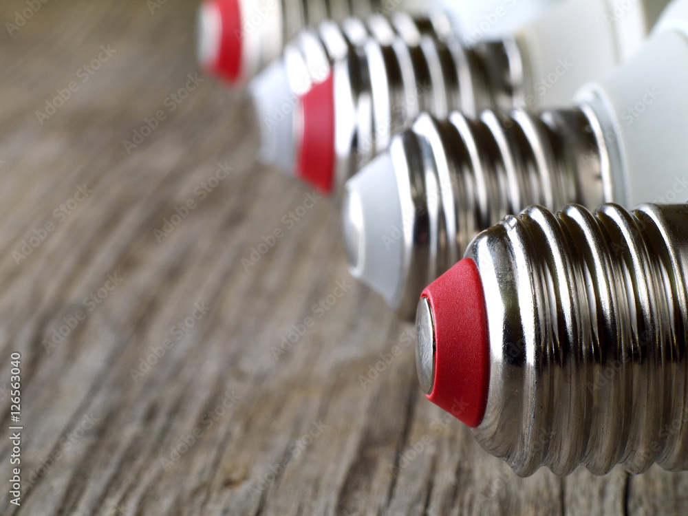 lamp bulb caps in a row, shallow depth of field, copy space lamp bulb caps in a row, shallow depth of field, copy space