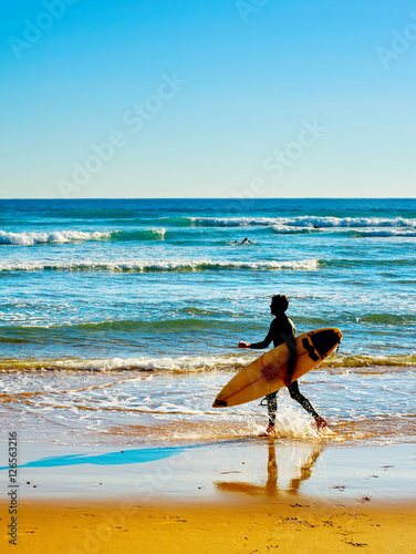 Surfer on a beach
