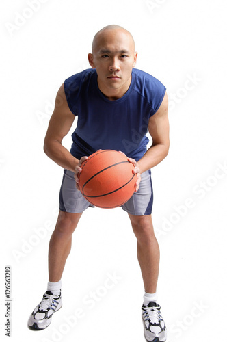 Young man holding basketball © Alexander