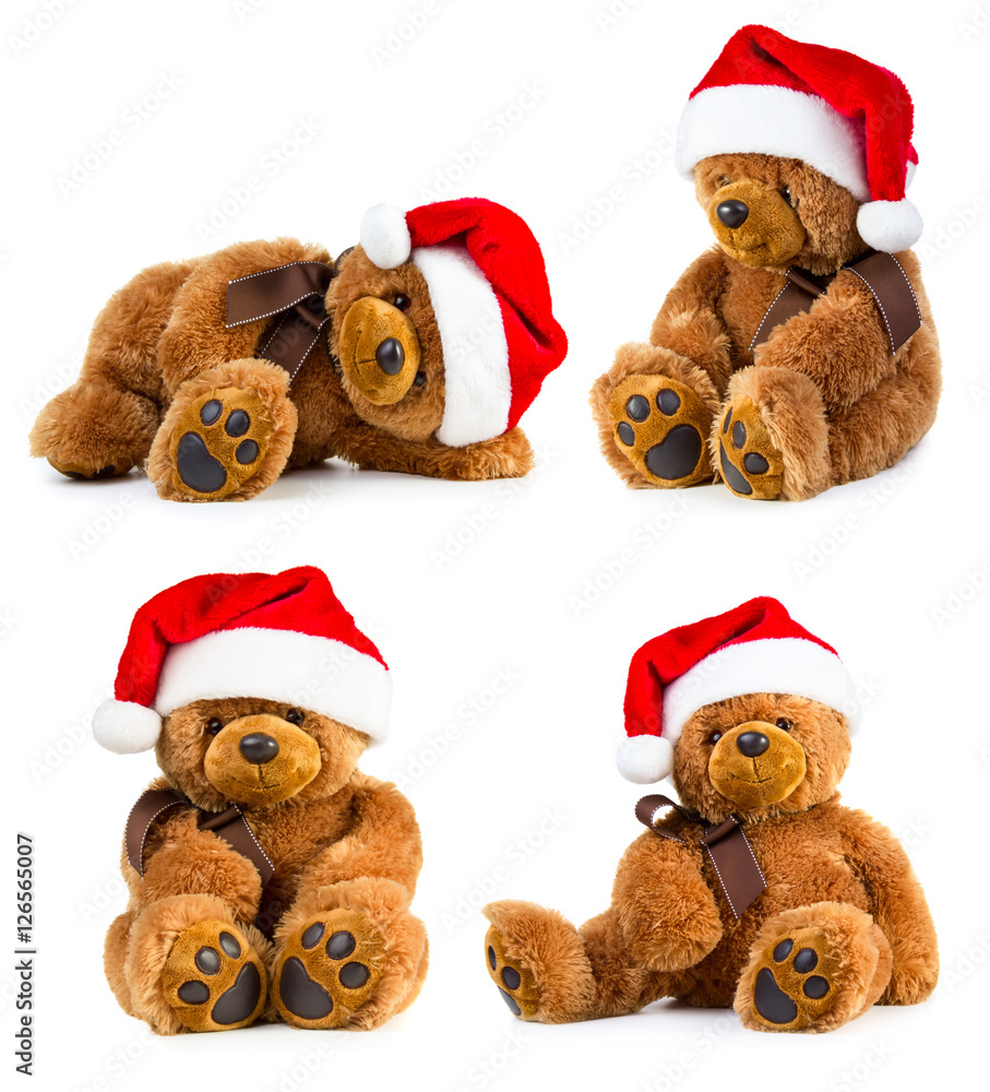 Four teddy bears wearing the santa hat Four teddy bears wearing the santa hat
