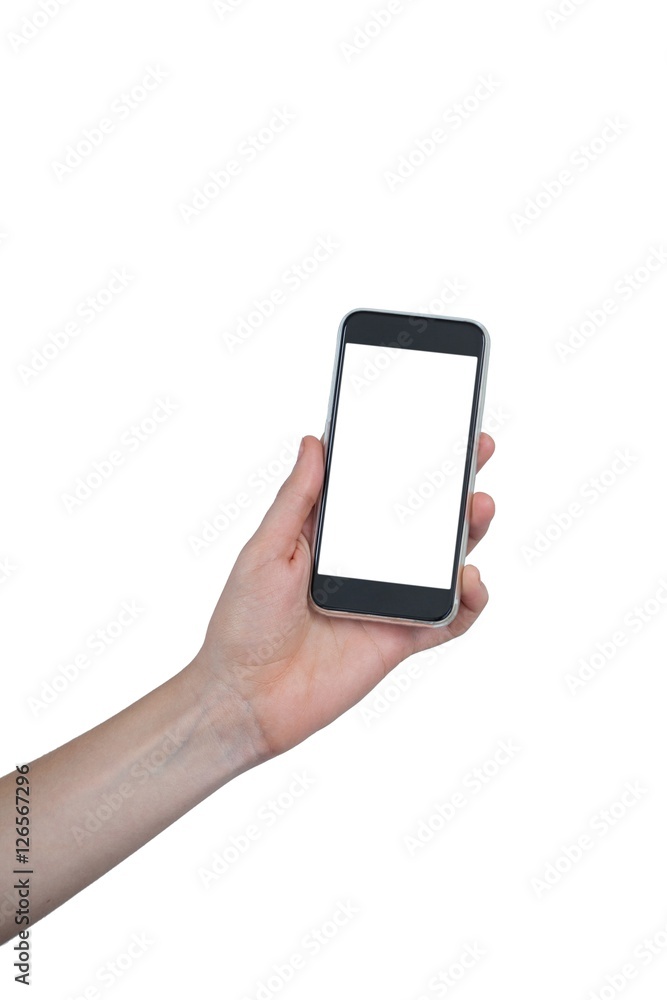 Hand holding mobile phone against white background Hand holding mobile phone against white background