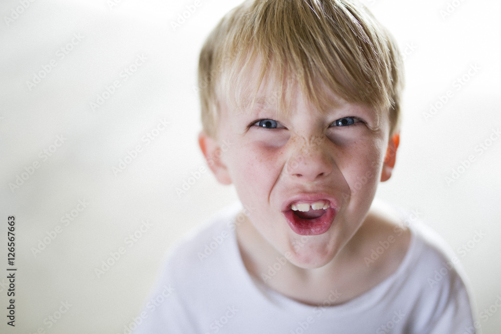 Portrait of boy pulling face Portrait of boy pulling face