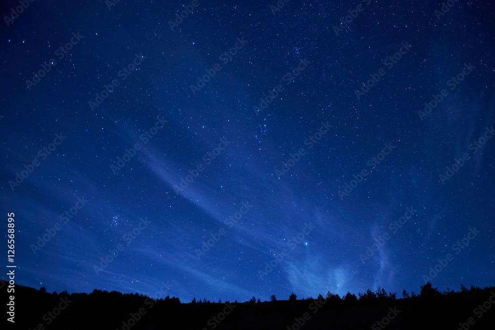 Naklejka Blue dark night sky with many stars