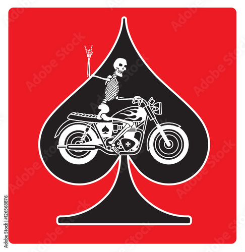 Vector logo or badge featuring a skeleton riding a vintage motorcycle on an ace of spades background. The skeleton is giving the two fingered devils horns heavy metal salute. photo