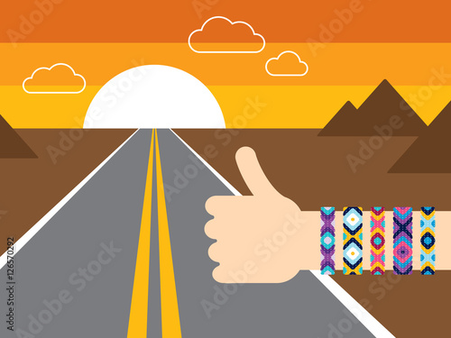 Hand with hippy friendship bracelets hitchhiking on the road