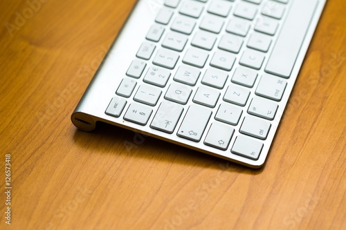 Close up of white wireless aluminum keyboard
