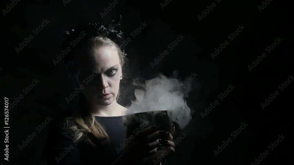 Dark portrait of evil witch with bowl. 4K UHD Dark portrait of evil witch with bowl. 4K UHD