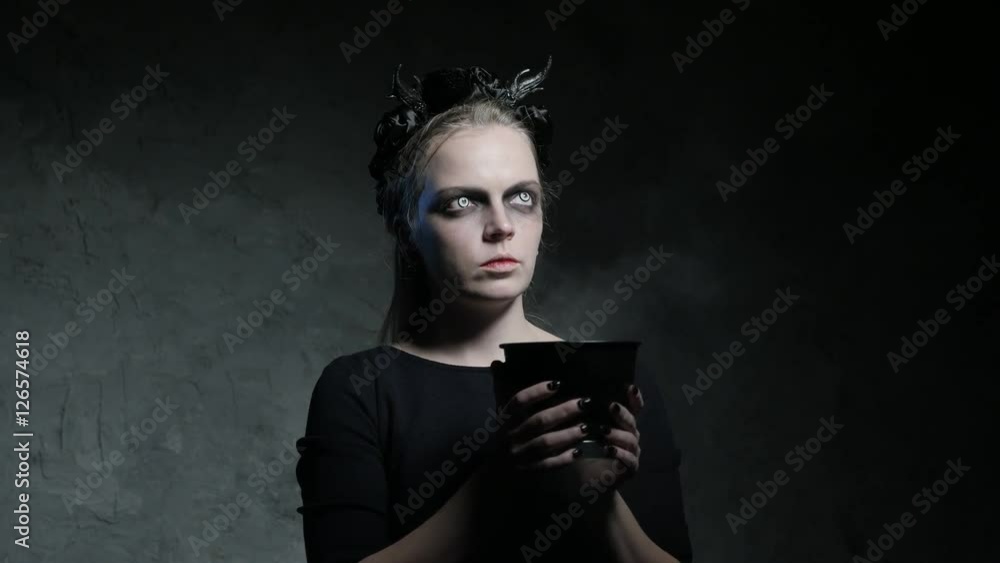 Dark portrait of evil witch with bowl. 4K UHD Dark portrait of evil witch with bowl. 4K UHD