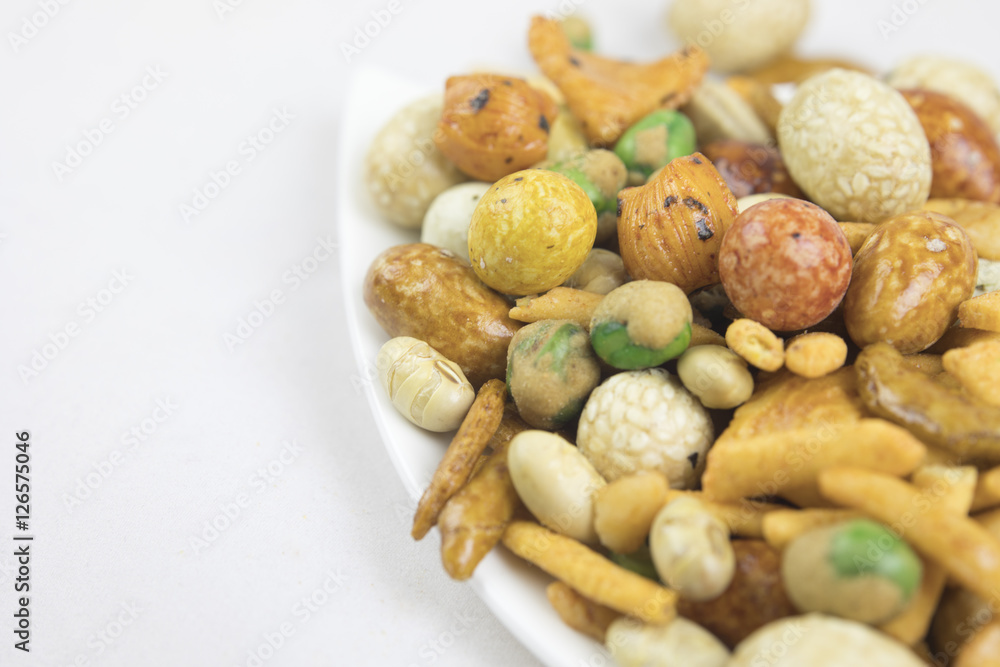 Fototapeta premium Mixed snacks rice, nuts and dried green beans