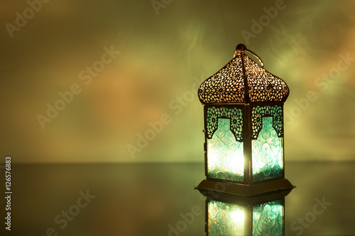 Low light view of colored Lantern on a glass photo