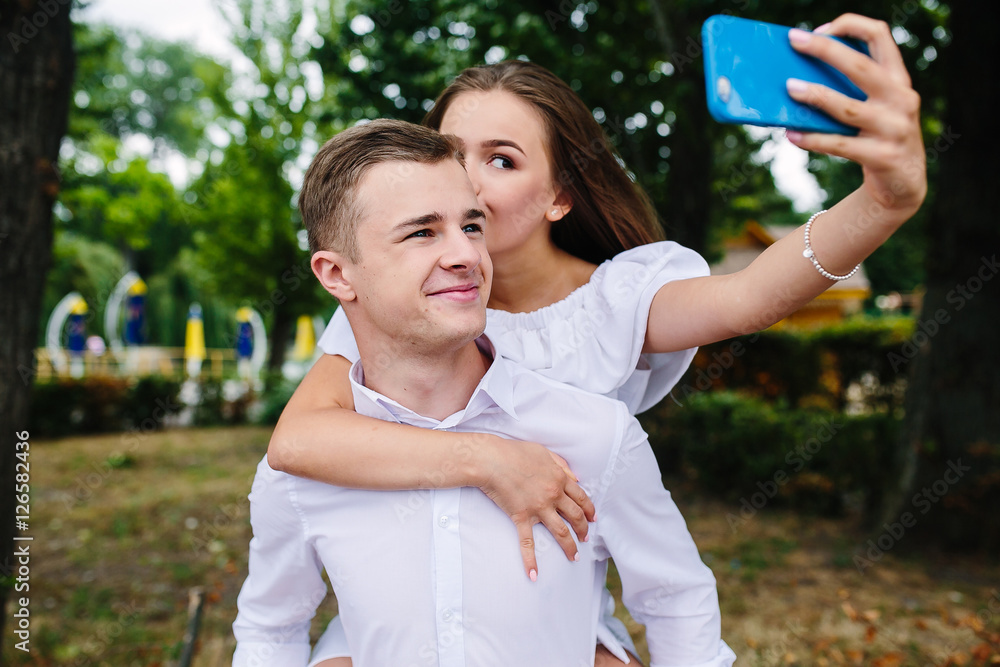 Beautiful young couple makes selfie Beautiful young couple makes selfie
