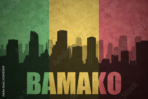 abstract silhouette of the city with text Bamako at the vintage malian flag
