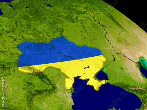 Ukraine with flag on Earth
