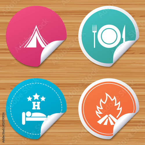 Round stickers or website banners. Food, sleep, camping tent and fire icons. Knife, fork and dish. Hotel or bed and breakfast. Road signs. Circle badges with bended corner. Vector