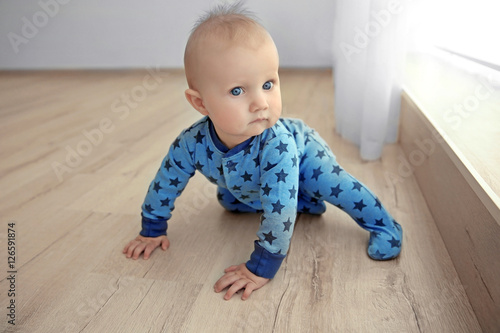 Adorable little baby crawli...