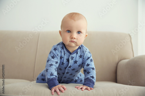 Adorable little baby crawli...