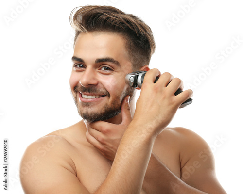 Handsome man shaving isolat...