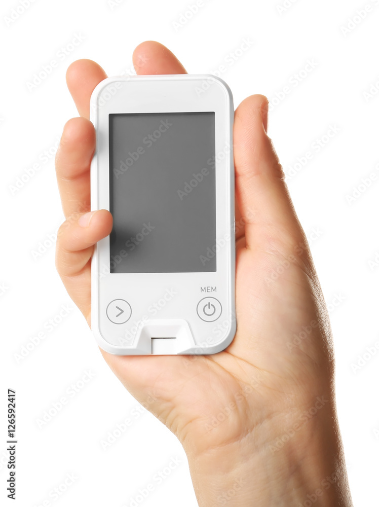 Male hand holding glucometer isolated on white Male hand holding glucometer isolated on white