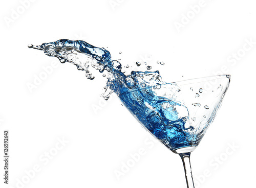 Blue cocktail with splash on white background