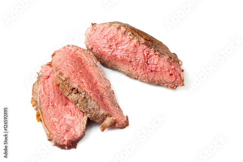 Tasty sliced steak isolated on white