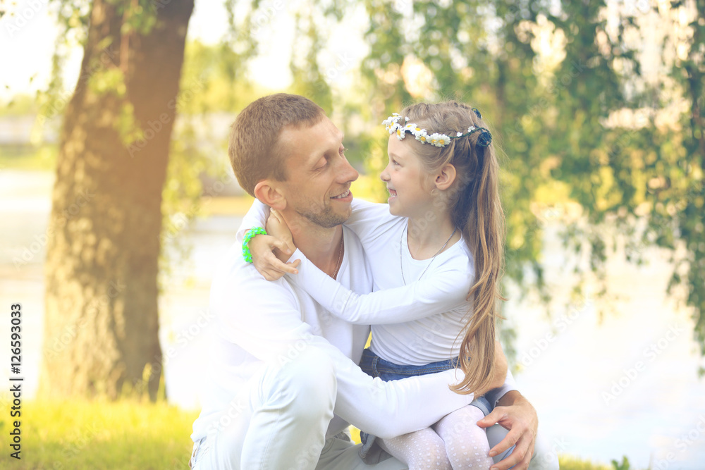 Happy father with daughter in summer park Happy father with daughter in summer park