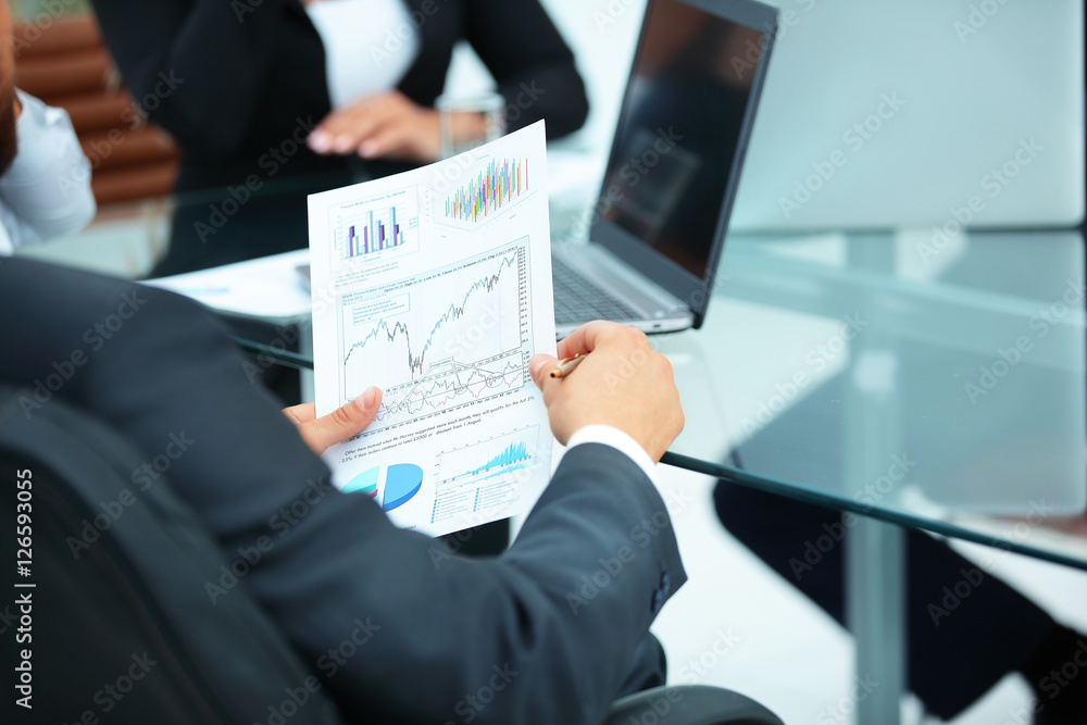 CFO looks at a graph of the financial condition of the company
