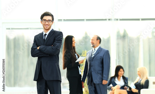 boss on the background of business team in office © yurolaitsalbert