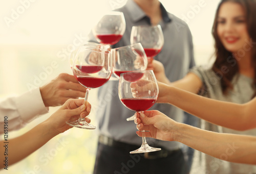 People toasting with glasse...