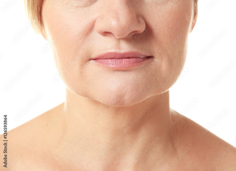 Obraz premium Face of senior adult woman on white background